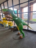 BENCH MADE LARGE OUTDOOR METAL T-REX YARD STATUE. GREEN AND YELLOW WITH BROWN ACCENTS. SITS ON REBAR