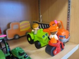 LOT OF ASSORTED TOYS. INCLUDES TOY CARS, MOTORCYCLE, WOODEN TRUCK SIGNS.
