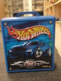 BLUE PLASTIC HOT WHEELS CARRYING CASE FILLED WITH ASSORTED TOY CARS. CASE HOLDS 100 CARS.