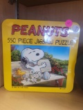 PEANUTS 550 PIECE JIGSAW PUZZLE IN COLLECTORS TIN. PUZZLE MEASURES 18