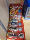 LOT OF (5) JOHNNY LIGHTNING TOY CARS WITH LIGHTING MOTION. ALL NEW IN PACKAGE.