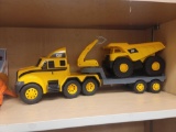 YELLOW AND BLACK CAT FLATBED TRACTOR TRAILER WITH DUMP TRUCK TOY. HAS LIGHTS AND SOUND.