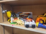 LOT OF ASSORTED TOYS. INCLUDES: A PAW PATROL VIEWER, 3 DINOSAURS, A FISHER PRICE DOG HOUSE, A FIRE