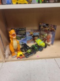 LOT OF ASSORTED TOYS. INCLUDES: JOHN DEERE TRACTOR, A RHINO, A T-REX, NASCAR BILL ELLIOTT ACTION