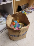 BAG LOT OF GUMBALL MACHINE CAPSULES. MOST APPEAR TO BE RINGS.