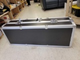 BLACK AND ALUMINUM FLIGHT CASE. HAS 2 HANDLES AND LOCKS. INSIDE IS LINED WITH PEGBOARD. MEASURES