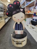 HARAJUKU LOVERS LOVE CARDBOARD CUT OUT. SITS ON ROUND FOLDING BASE. MEASURES APPROX 12