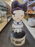 HARAJUKU LOVERS MUSIC CARDBOARD CUT OUT. SITS ON ROUND FOLDING BASE. MEASURES APPROX 12