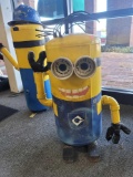 BENCHMADE MINIONS YARD ORNAMENT MADE FROM AN OLD TANK. PAINTED YELLOW WITH BLUE OVERALLS. HAS WIRE
