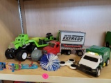 LOT OF ASSORTED TOYS. INCLUDES: A GARBAGE TRUCK, A TRACTOR TRAILER WITH HEAVY EQUIPMENT, FINGER