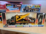 REMOTE CONTROL HIGHWAY TOW TRUCK WITH FAST RUNNING RALLY AND TRAILER. NEW IN ORIGINAL BOX.