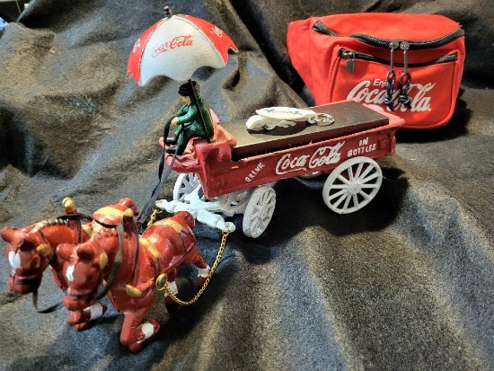 VINTAGE COCA COLA CAST IRON HORSE & DRAWN WAGON. ALSO, COMES WITH COCA COLA FANNY PACK. IS SOLD AS