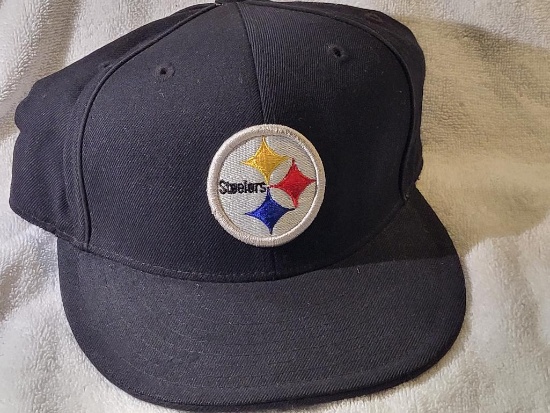 PITTSBURGH STEELERS OFFICIAL NFL HAT. SIZE 7 3/4. IS SOLD AS IS WHERE IS WITH NO GUARANTEES OR