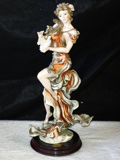 FLORENCE GUISEPPE ARMANI HAND CRAFTED FIGURINE. LADY HOLDING BIRD. MEASURES APPROX. 14.5". RETAILS