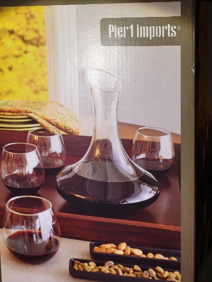 BRAND NEW PIER 1 IMPORTS WINE DECANTER SET. COMES WITH DECANTER AND 4 WINE GLASSES. IS SOLD AS IS