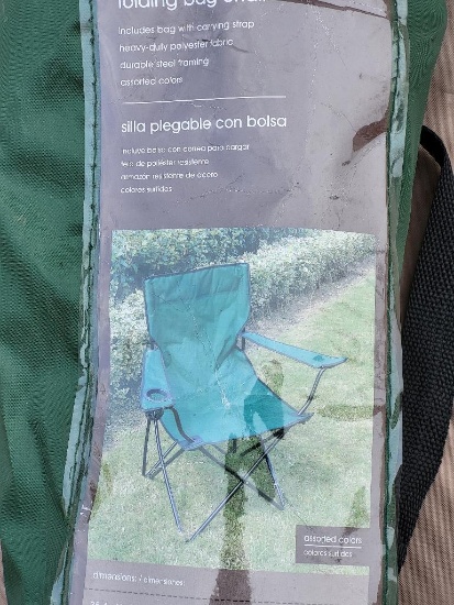 GREEN FOLDING BAG CHAIR. MEASURES APPROX. 35.4" H X 34.7" W X 20.9" D. IS SOLD AS IS WHERE IS WITH