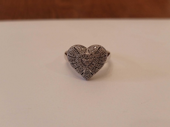 (DR) MARKED "925" STERLING SILVER HEART SHAPED RING, ACCENTED WITH SM. CZ CHIPS. IT WEIGHS APPROX.