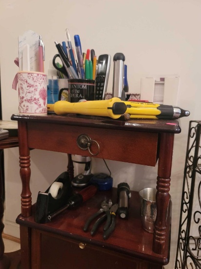 (DR) LOT OF ASSORTED ITEMS ON TABLE. INCLUDES: A PANASONIC CORDLESS PHONE, THUMB'S UP DRIVER