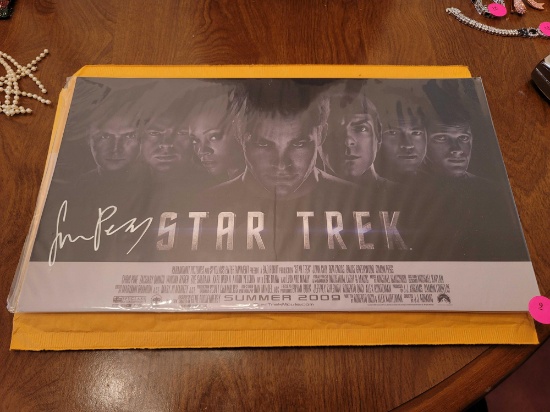 (DR) AUTOGRAPHED STAR TREK MOVIE LOBBY CARD, SIGNED BY SIMON PEGG. COMES WITH A COA, MARKED AS ONE