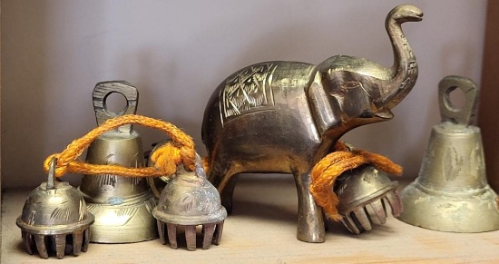 BRASS LOT TO INCLUDE A PAIR OF BELLS, A BRASS ELEPHANT, AND BRASSS JINGLE BELLS. IS SOLD AS IS WHERE