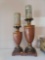 (LR) LOT OF 2 CANDLESTICK HOLDERS. DIFFERENT SIZES BUT BOTH HAVE A WOOD LOOK WITH PAINTED DETAILING.