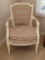 (BR1) VINTAGE WHITE PAINTED ARM CHAIR WITH WHITE & MULTI COLORED UNIQUE DESIGN UPHOLSTERY. IT