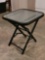 (GAR) BLACK METAL AND TEMPERED GLASS PATIO SIDE TABLE, FOLDS UP. IT MEASURES APPROX. 16