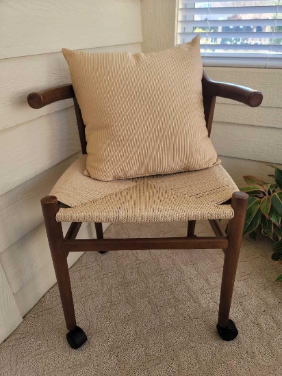 (SUNRM) WOODEN ROLLING CHAIR WITH LINEN COLORED WOVEN SEAT. NUMBERED ON INSIDE LEG "46-090863-130"