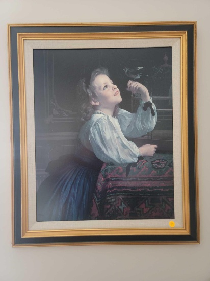 (MBR) FRAMED PRINT OF A YOUNG GIRL WITH A BIRD PERCHED ON HER FINGER. FRAME IS LINEN COLORED, BLACK