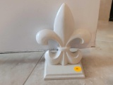 (LR) SM. WHITE PAINTED METAL FLUER DE LIS DOOR STOPPER BY BALLARD DESIGNS. IT MEASURES APPROX. 4