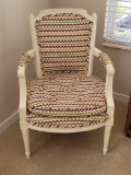 (BR1) VINTAGE WHITE PAINTED ARM CHAIR WITH WHITE & MULTI COLORED UNIQUE DESIGN UPHOLSTERY. IT