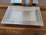 (BR1) CONTEMPORARY SILVER TONED DRESSER TRAY ON ROUND WOODEN FEET. IT MEASURES APPROX. 22-1/2