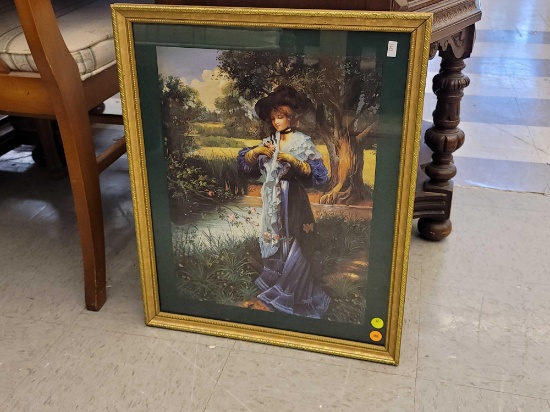 (R1) FRAMED PRINT DEPICTING A VICTORIAN ERA GIRL IN A BLUE DRESS WALKING ON A PATH WITH A STREAM