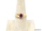 14K YELLOW GOLD RUBY & DIAMOND CHIP RING. OVAL CUT PRONG SET RUBY GEMSTONE BORDERED WITH ROUND CUT