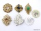 LOT OF (7) VINTAGE DECORATIVE BROOCHES TO INCLUDE A GOLD TONE LEAF/GREEN STONE BROOCH 2-1/2