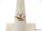 14K H.G.E. YELLOW GOLD RING WITH MARQUISE CUT SIMULATED OPALS WITH A SINGLE CZ CHIP. MARKED ON THE