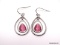 PAIR OF LIA SOPHIA SILVER TONE PEAR SHAPE PIERCED DANGLE EARRINGS WITH PINK LAB CREATED GEMSTONE.