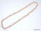 VINTAGE CAROLEE LARGE PINK FAUX. PEARL NECKLACE STRAND WITH SILVER TONE TOGGLE CLASP. MARKED ON THE
