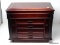 DARK STAINED LIFT TOP FOUR DRAWER JEWELRY CHEST WITH SIDES THAT OPEN. THE LIFT TOP OPENS UP TO A