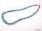 TURQUOISE GRADUATED BALL BEAD NECKLACE WITH RED CORAL SPACERS & A STERLING SILVER TOGGLE CLASP. IT