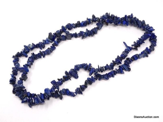 NATURAL MINED BLUE LAPIS STONE NECKLACE. IT MEASURES APPROX. 33" LONG.