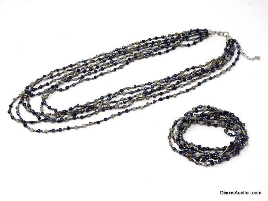 MODERN SIX STRAIN BLACK, BLUE & CLEAR NECKLACE WITH A SILVER TONED LOBSTER CLASP 22" LONG. COMES
