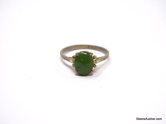 .925 STERLING SILVER WITH AN OVAL CUT PRONG SET JADE CENTER STONE. RING SIZE 7-1/2. MARKED 925 SS ON