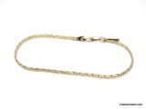 18K YELLOW GOLD PLATE BRACELET WITH A TAG MARKED 