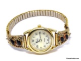 NADIA QUARTZ GOLD TONE WRIST WATCH WITH STERLING SILVER GOLD VERMEIL & BLACK ONYX WATCH ARMS WITH