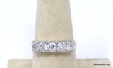 .925 STERLING SILVER RING WITH A ROW OF (5) ROUND CUT CZ GEMSTONES. MARKED ON THE INSIDE 