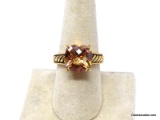 LIA SOPHIA GOLD TONE 4 CARAT CUSHION CUT ORANGE CITRINE GEMSTONE RING. MARKED ON THE INSIDE 