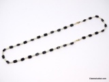 FAUX. BLACK ONYX, PEARL & GOLD TONE BALL BEAD NECKLACE WITH GOLD LOBSTER CLASP. THE NECKLACE