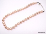 VINTAGE CAROLEE LARGE PINK FAUX. PEARL NECKLACE STRAND WITH SILVER TONE HOOK CLASP. IT MEASURES