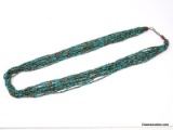 12 STRAND TURQUOISE AND BRONZE COLORED SEED BEAD NECKLACE WITH BRONZE TONED CAPS & LOBSTER CLASP. IT